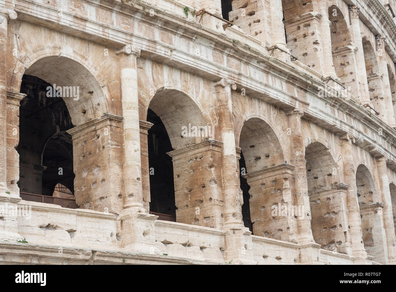 Arches of the Colosseum closeup. Attraction of the city of Rome in