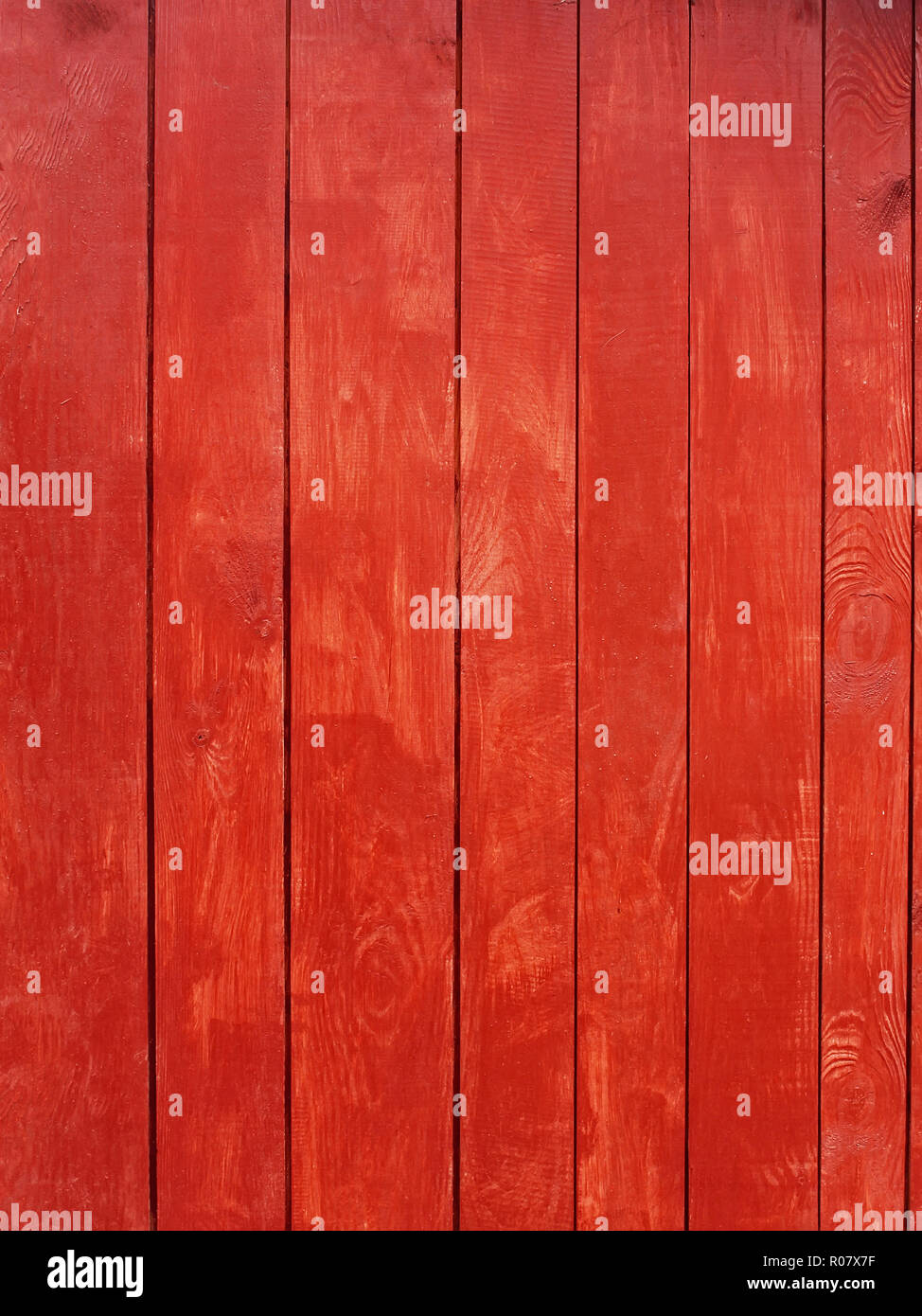 Vertical parallel wooden planks, painted in red Stock Photo