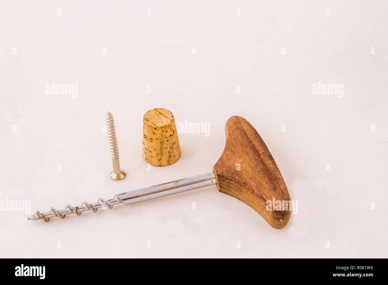 A cork a screw and a corkscrew isolated on a white background image with copy space in landscape format Stock Photo