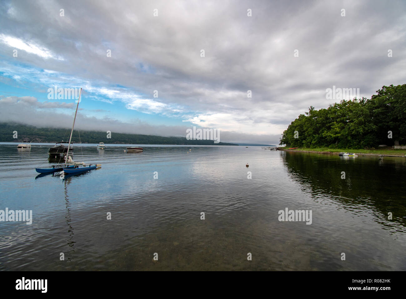 Small bay with boats on a cloudy morning Stock Photo
