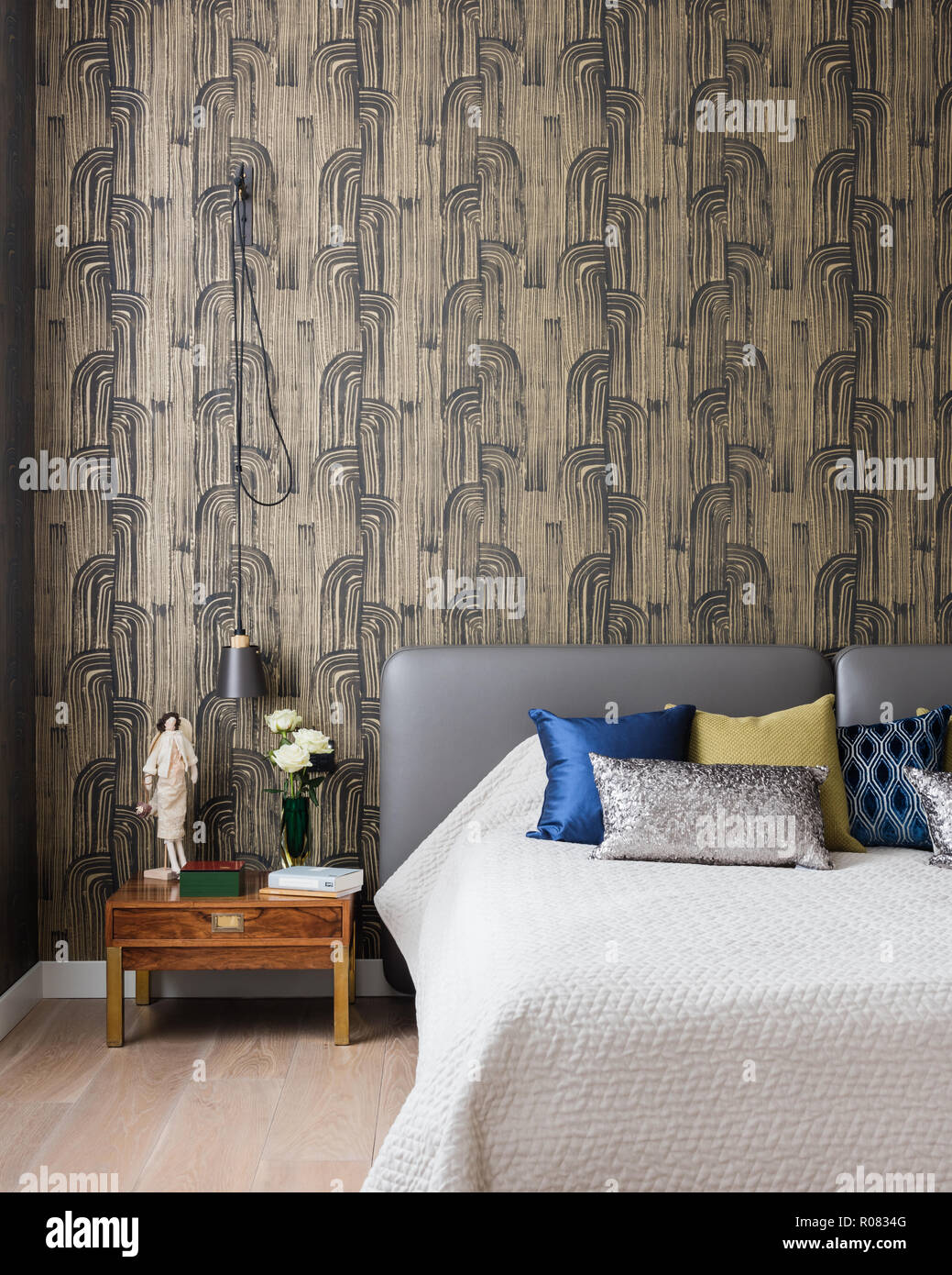 Modern Bedroom With Patterned Wallpaper Stock Photo