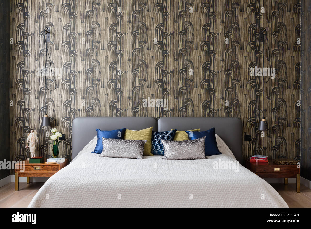 Modern Bedroom With Patterned Wallpaper Stock Photo