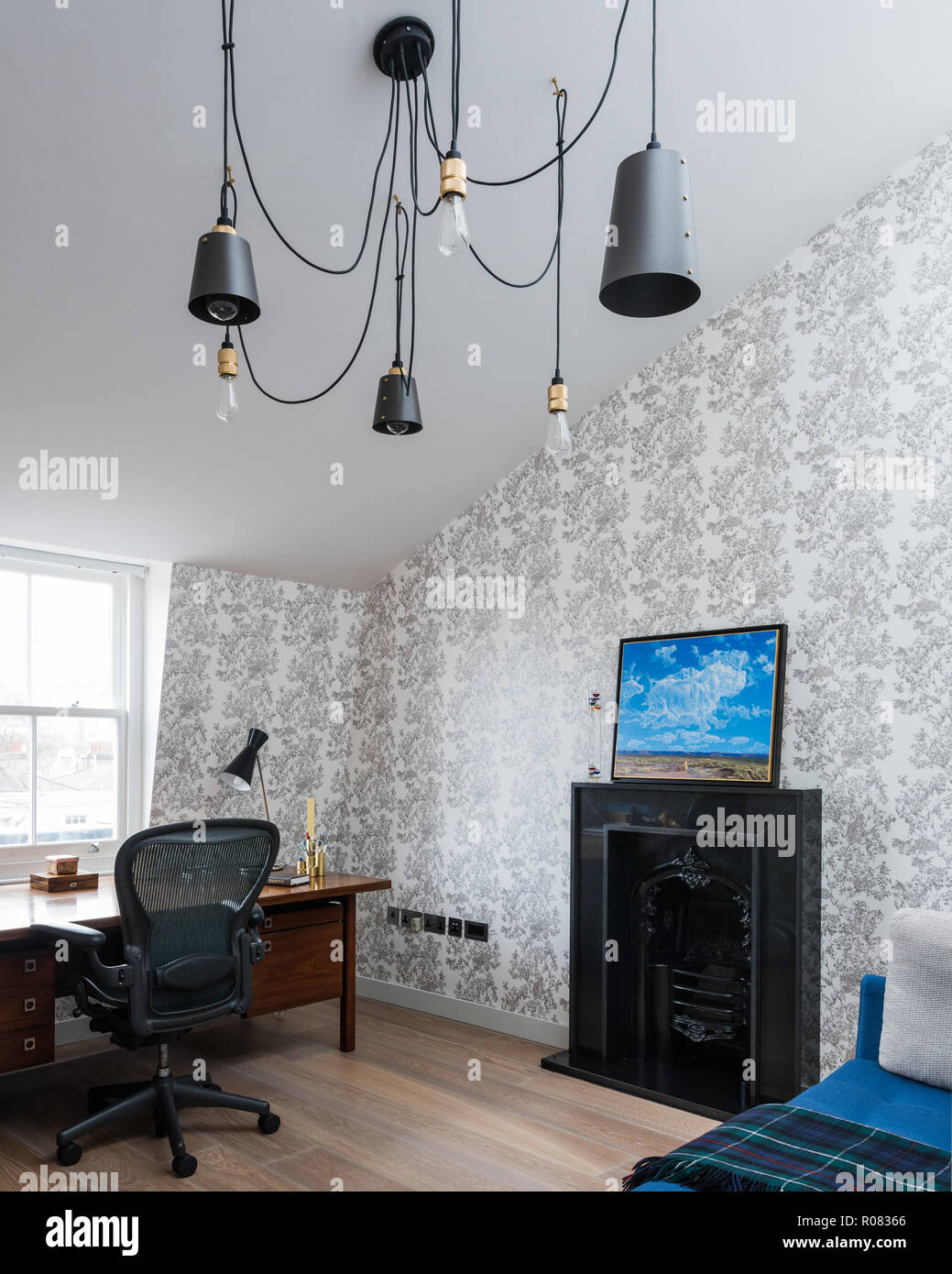 Eclectic bathroom with desk and fireplace Stock Photo