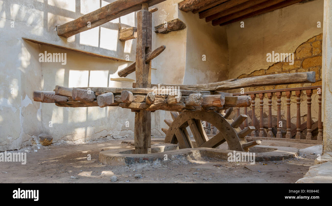 Ancient rotary Flour Mill used to be rotated by animal power in front of El Sehemy historic house, El Moez street, Cairo, Egypt Stock Photo
