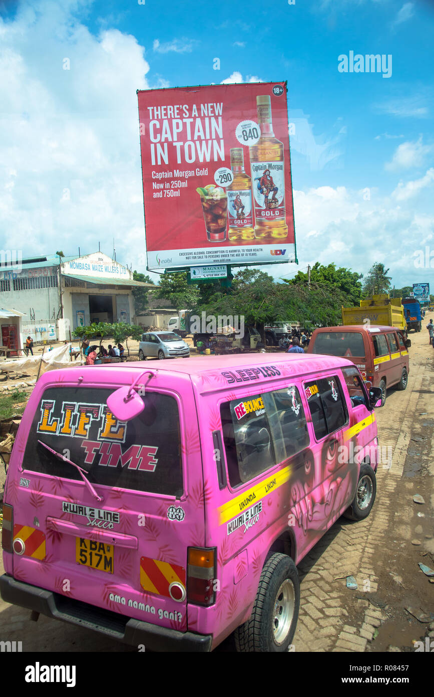 huge billboard at Mombasa with mini bus Kenya Stock Photo