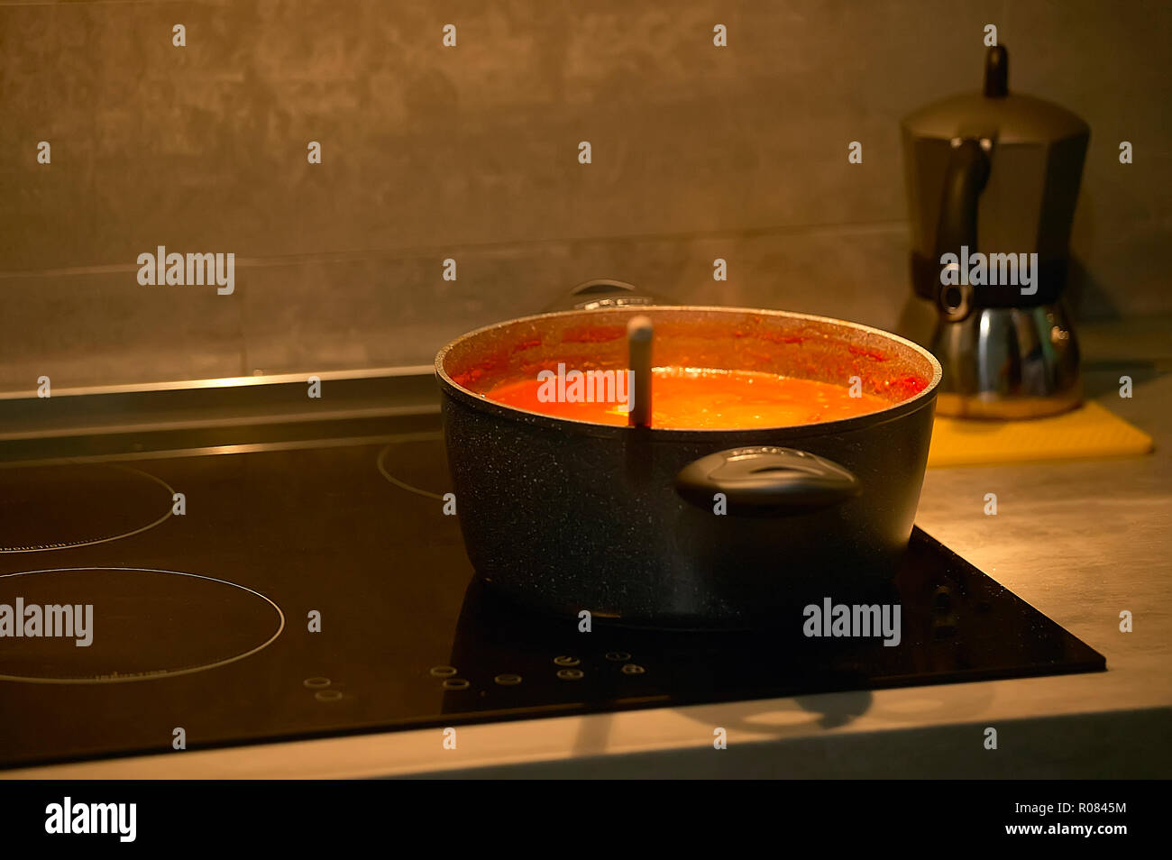 Saucepan that cooks in the kitchen above an induction cooker of the