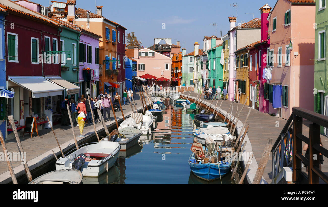 Canal view of the brightly painted house on the island of Burano in the Venetian Lagoon Stock Photo