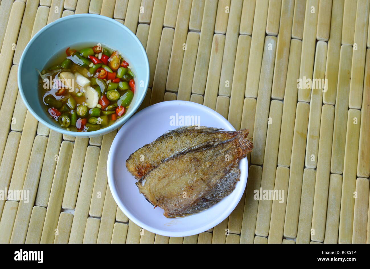 solid frying fish dipping with chili sauce Stock Photo Alamy