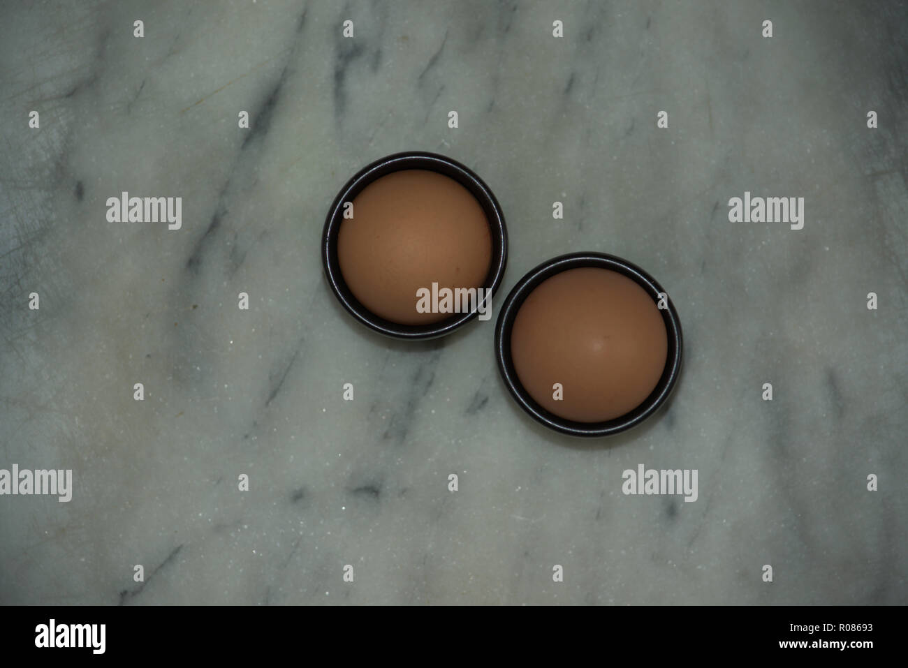 Two eggs in egg cups Stock Photo