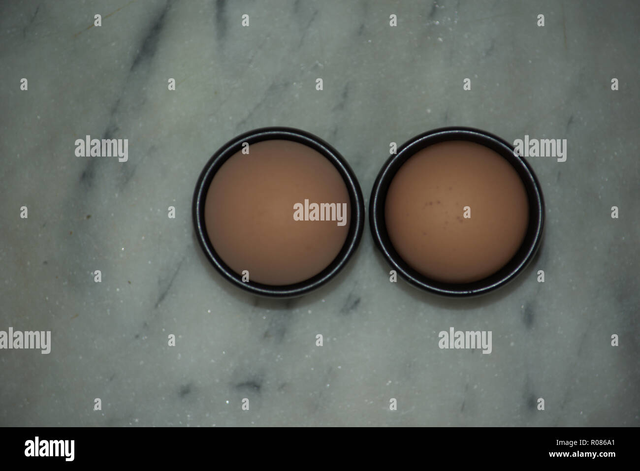 Two eggs in egg cups Stock Photo