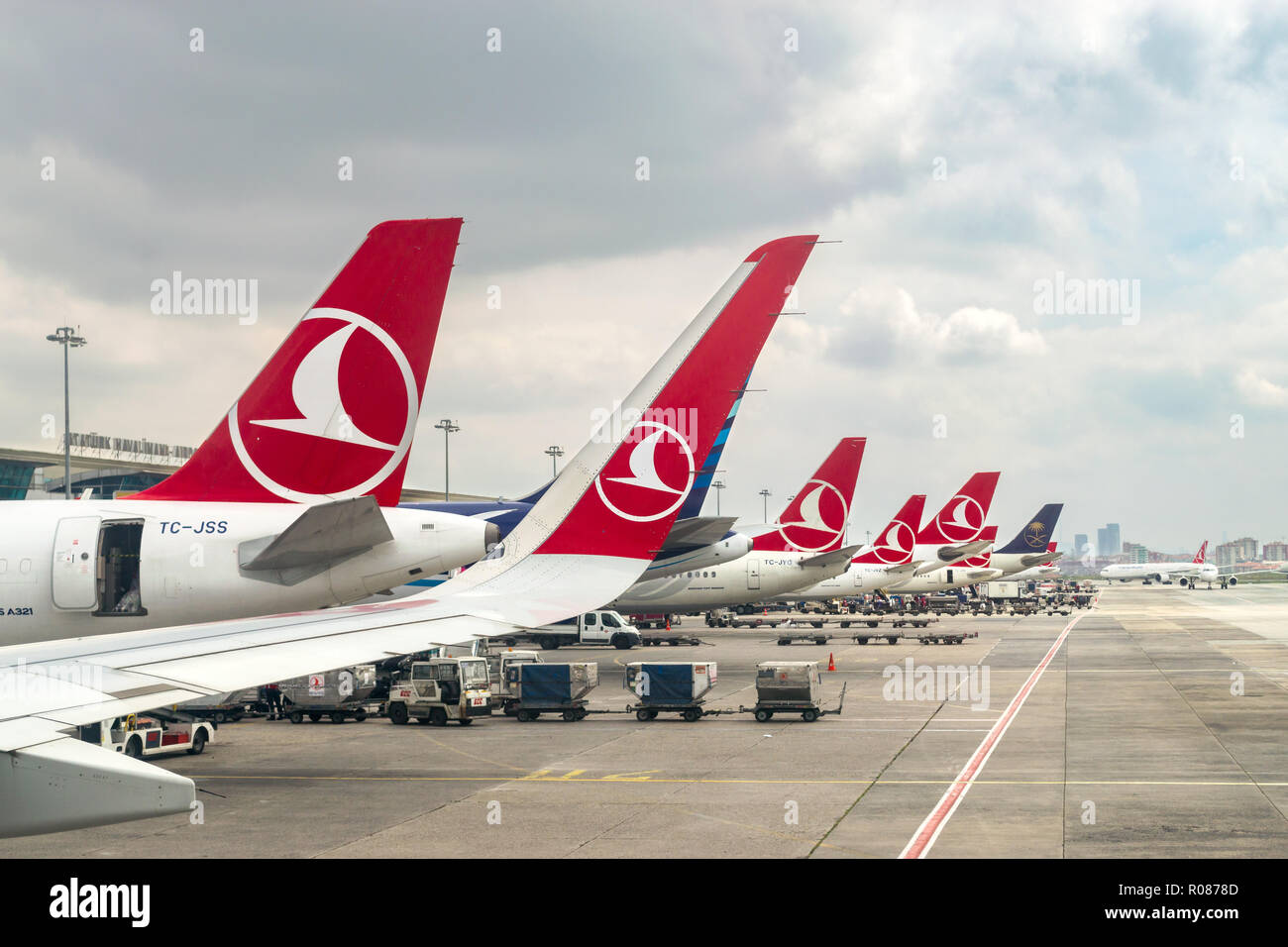 View of a row of Turkish Airlines aircraft tails with livery on the