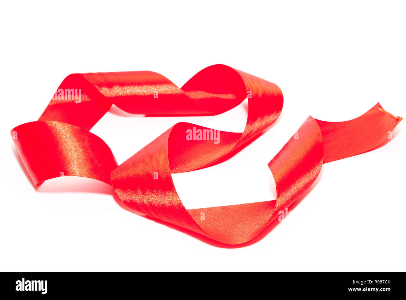 red ribbon isolated on a white background Stock Photo - Alamy