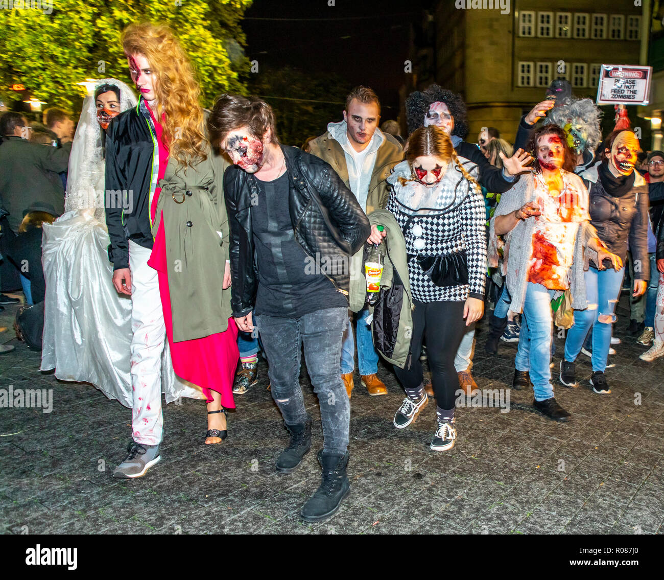 Participants of the zombie walk in Essen, on Halloween evening, in the city center, many hundreds of zombie and monster performers meet and move throu Stock Photo