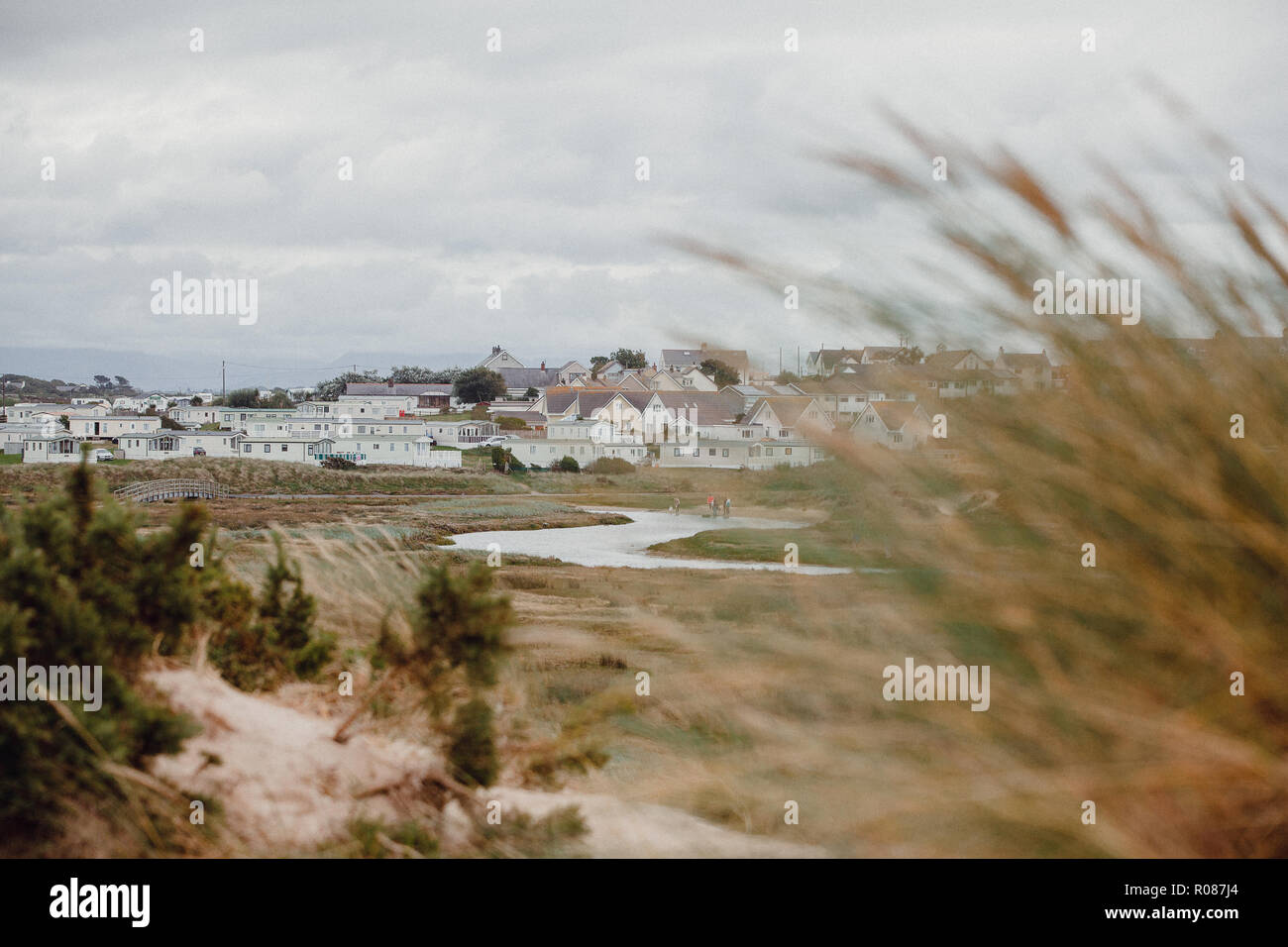 View of static homes in Rhosneigr from up in the sand dunes on Cymyran beach, Anglesey, North Wales, UK Stock Photo