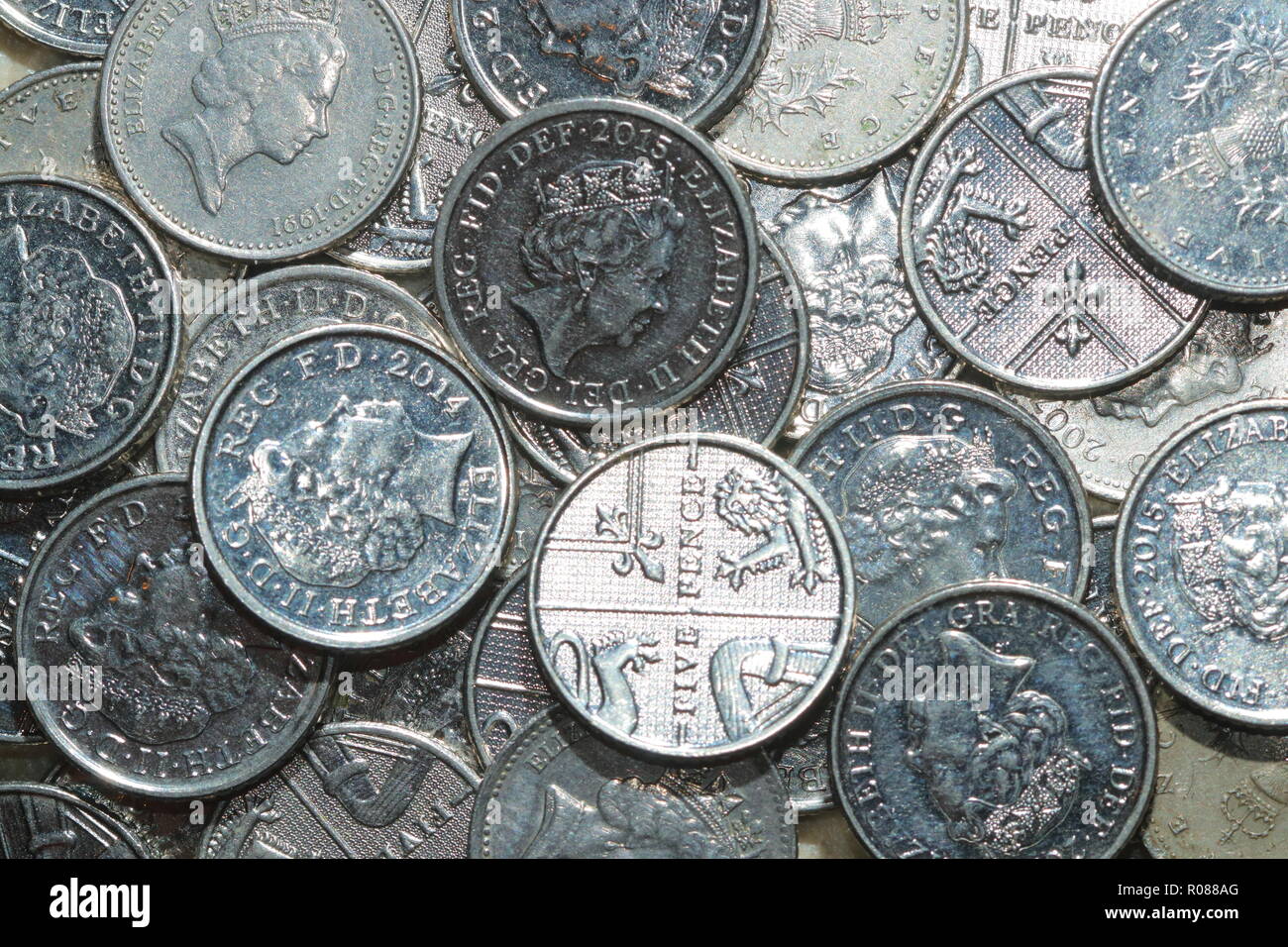 A pile of 5 pence coins, which are Britain's smallest silver coins
