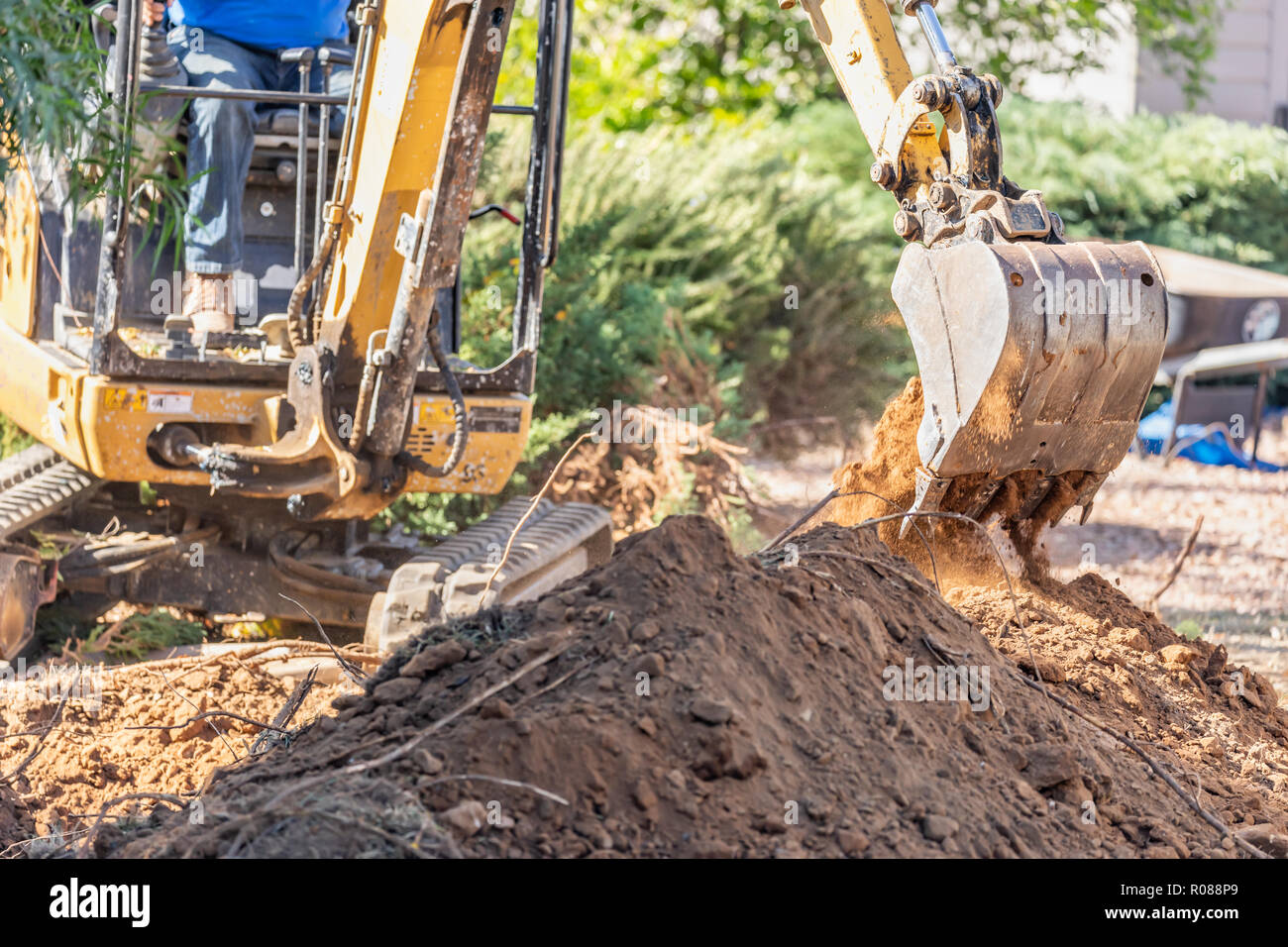Working Excavator Tractor Digging A Trench At Construction Site Stock