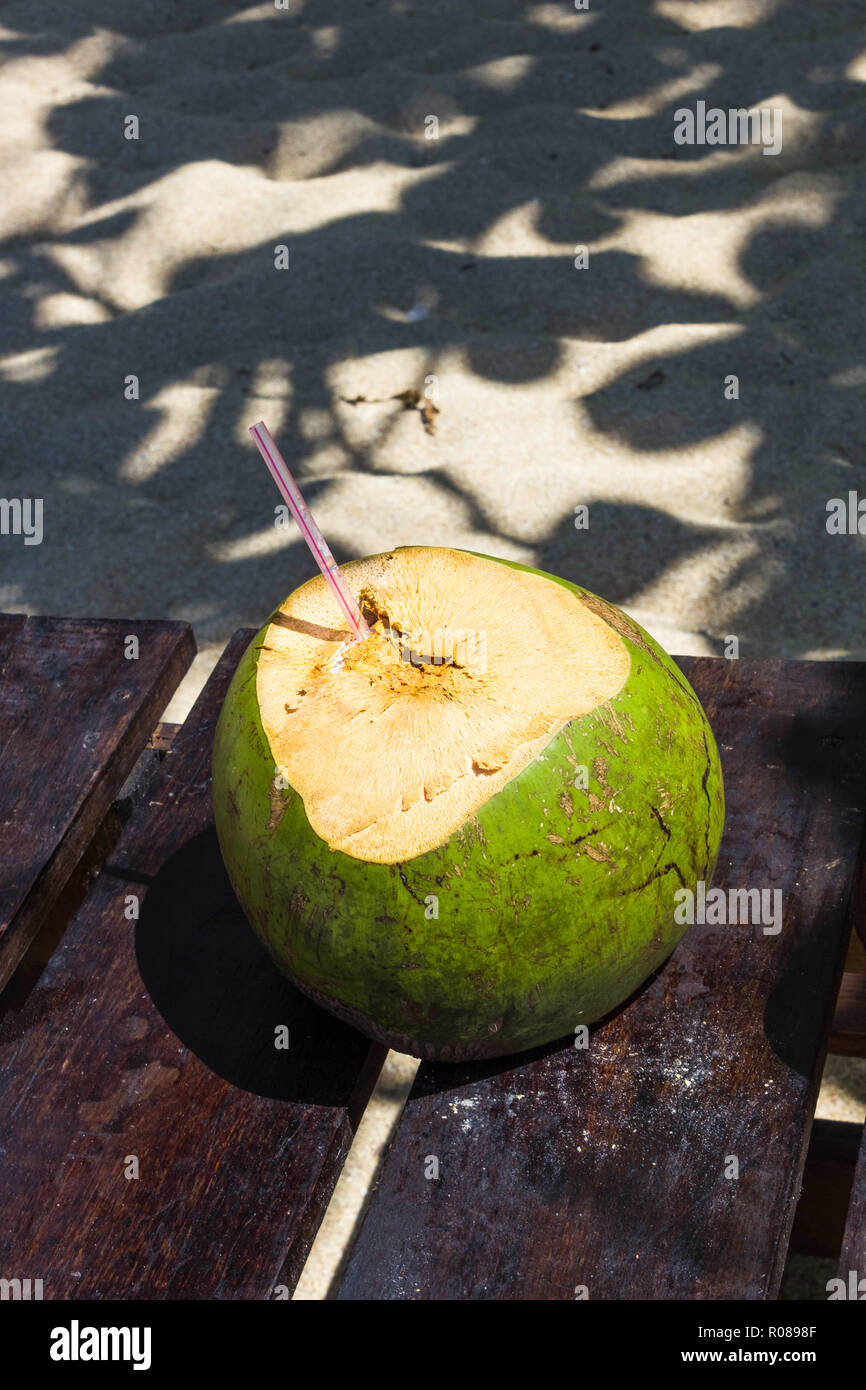 Green coconuts with drinking straw Stock Photo Alamy