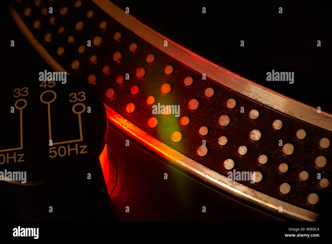 Detail of the plate of a vintage dj turntable with strobe light turned on  for the evaluation of the time set up of the track. Flat still Stock Photo  - Alamy