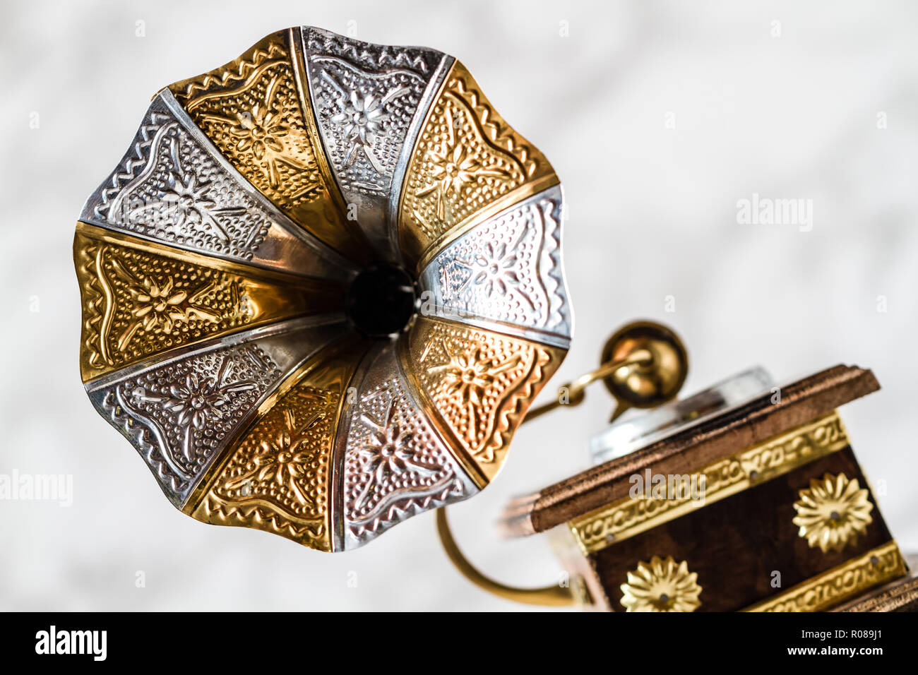 Old gramophone with horn speaker over plates Stock Photo Alamy
