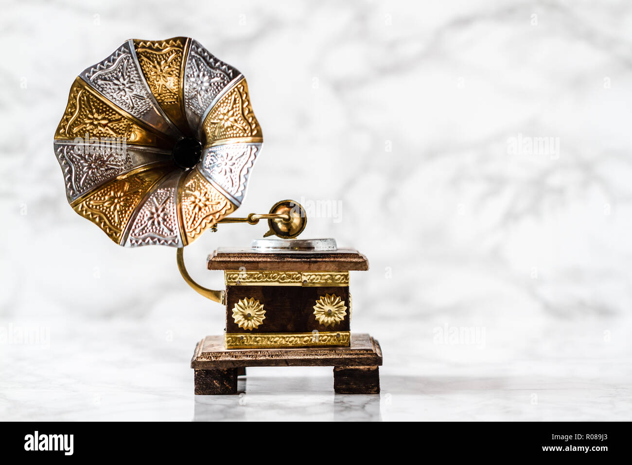 Old gramophone with horn speaker over plates Stock Photo Alamy