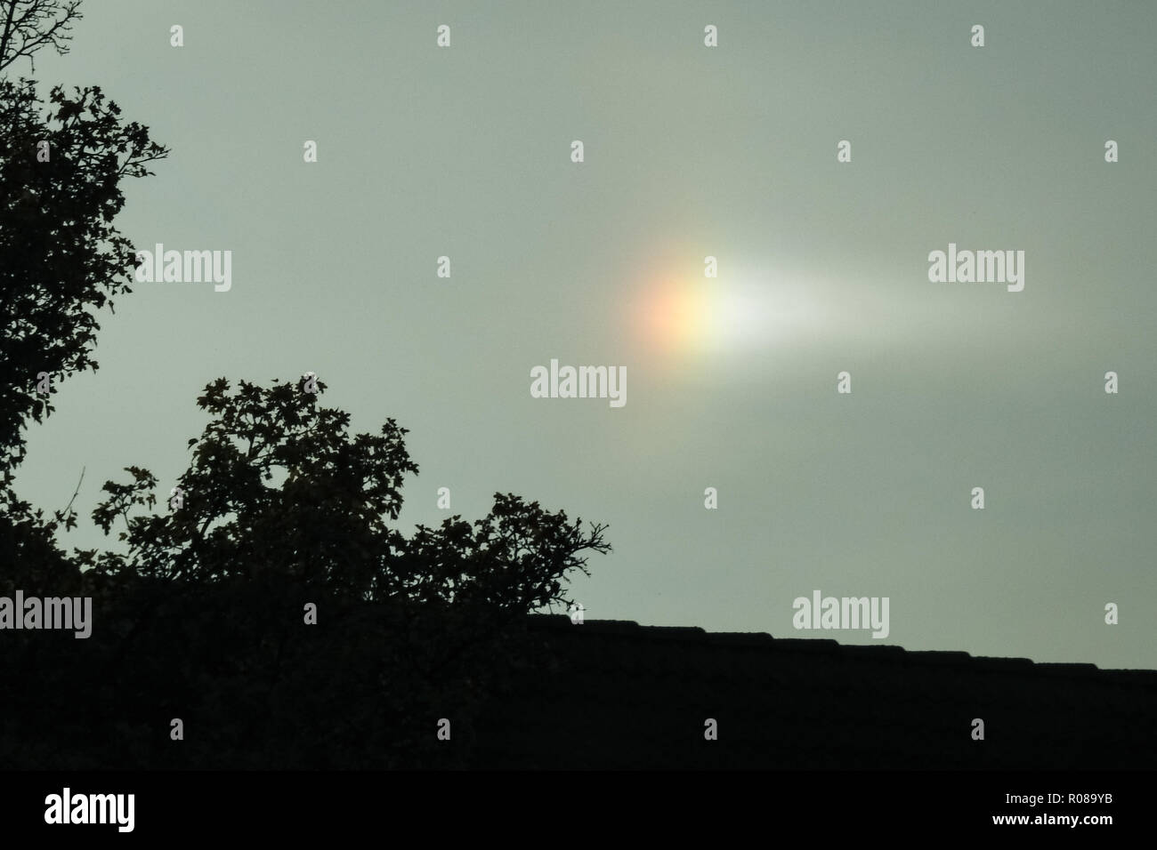 A bright colorful parhelion or sundog in the sky Stock Photo