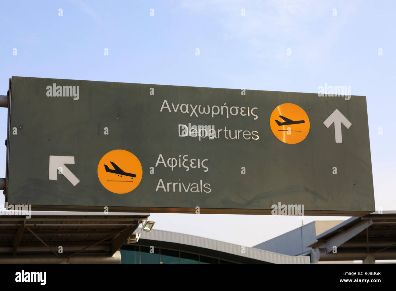 Arrivals and departures sign in English and Greek, Glafcos Clerides international airport, Larnaca,Cyprus October 2018 Stock Photo