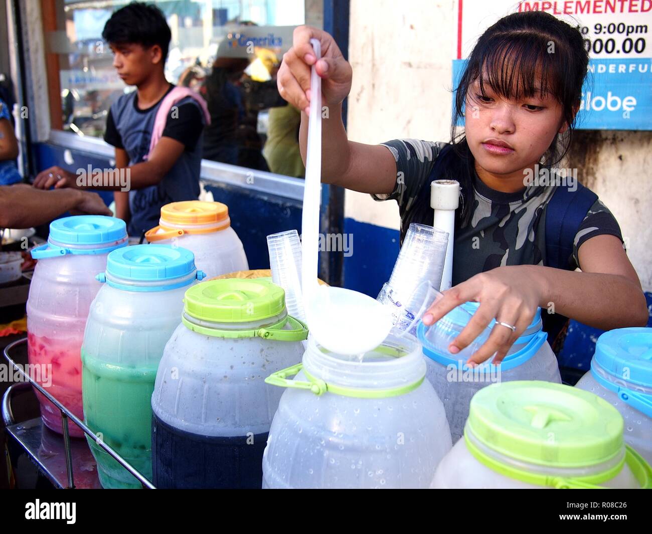 Coconut seller and a woman hires stock photography and images Alamy