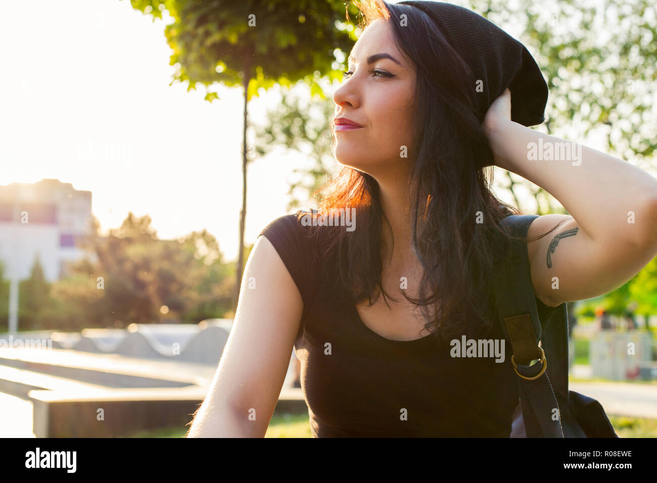 Beautiful teen girl 14-16 year old wearing stylish autumn clothes in park.  Looking at camera Stock Photo - Alamy