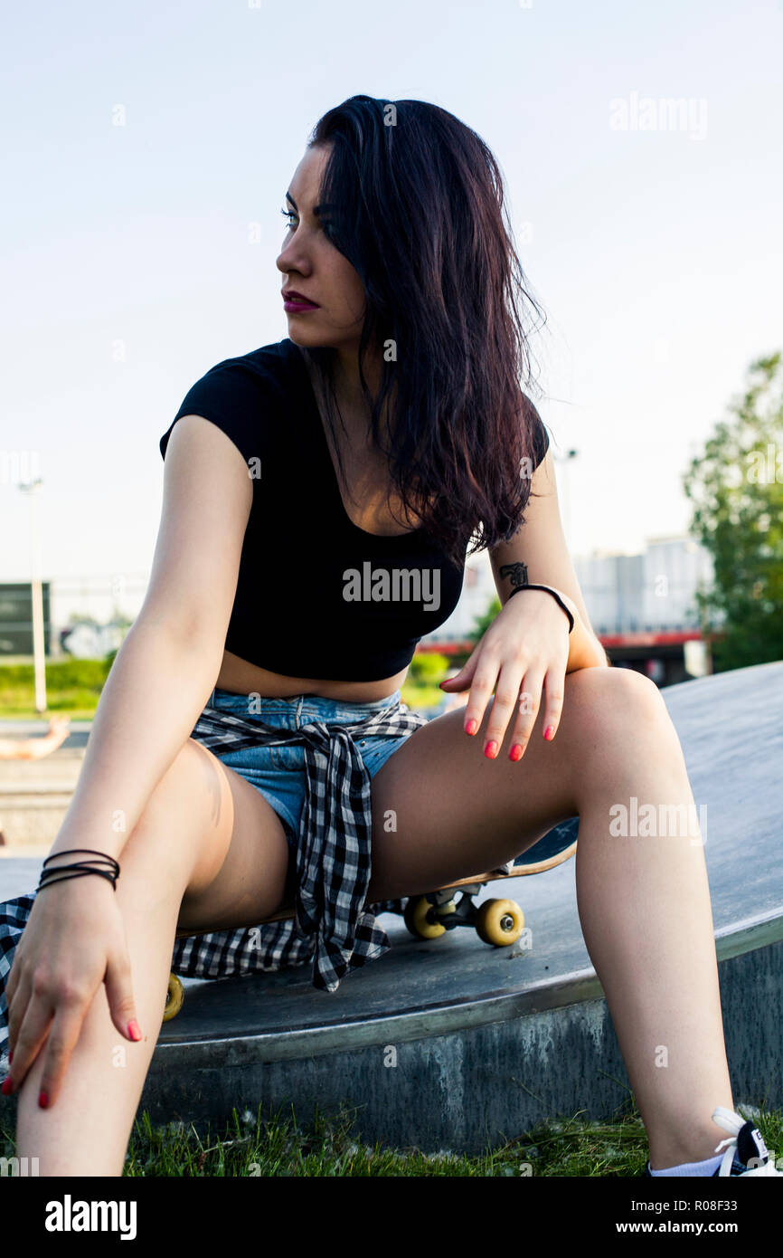Skateboard teen girl in skate park Stock Photo