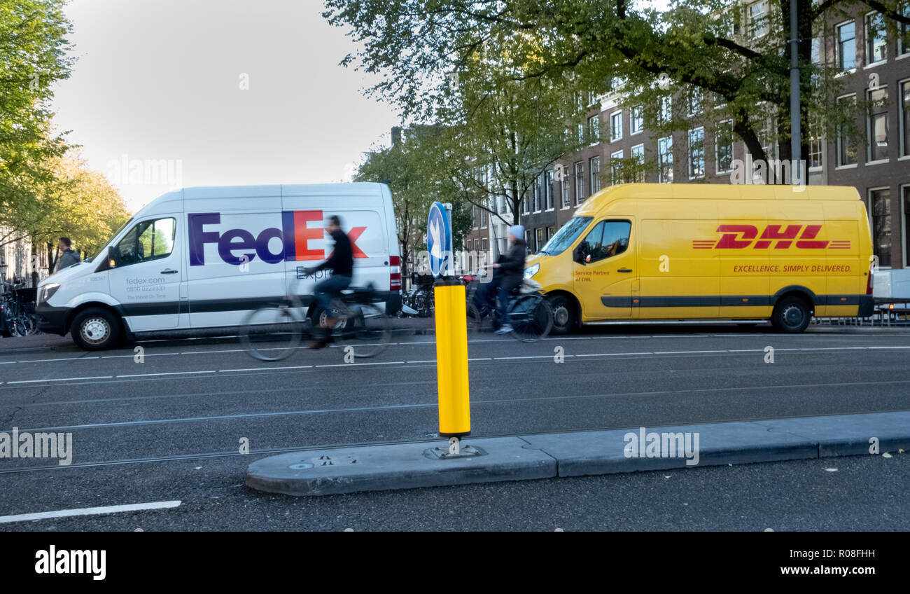 Competing parcel delivery in Amsterdam, Netherlands Stock Photo