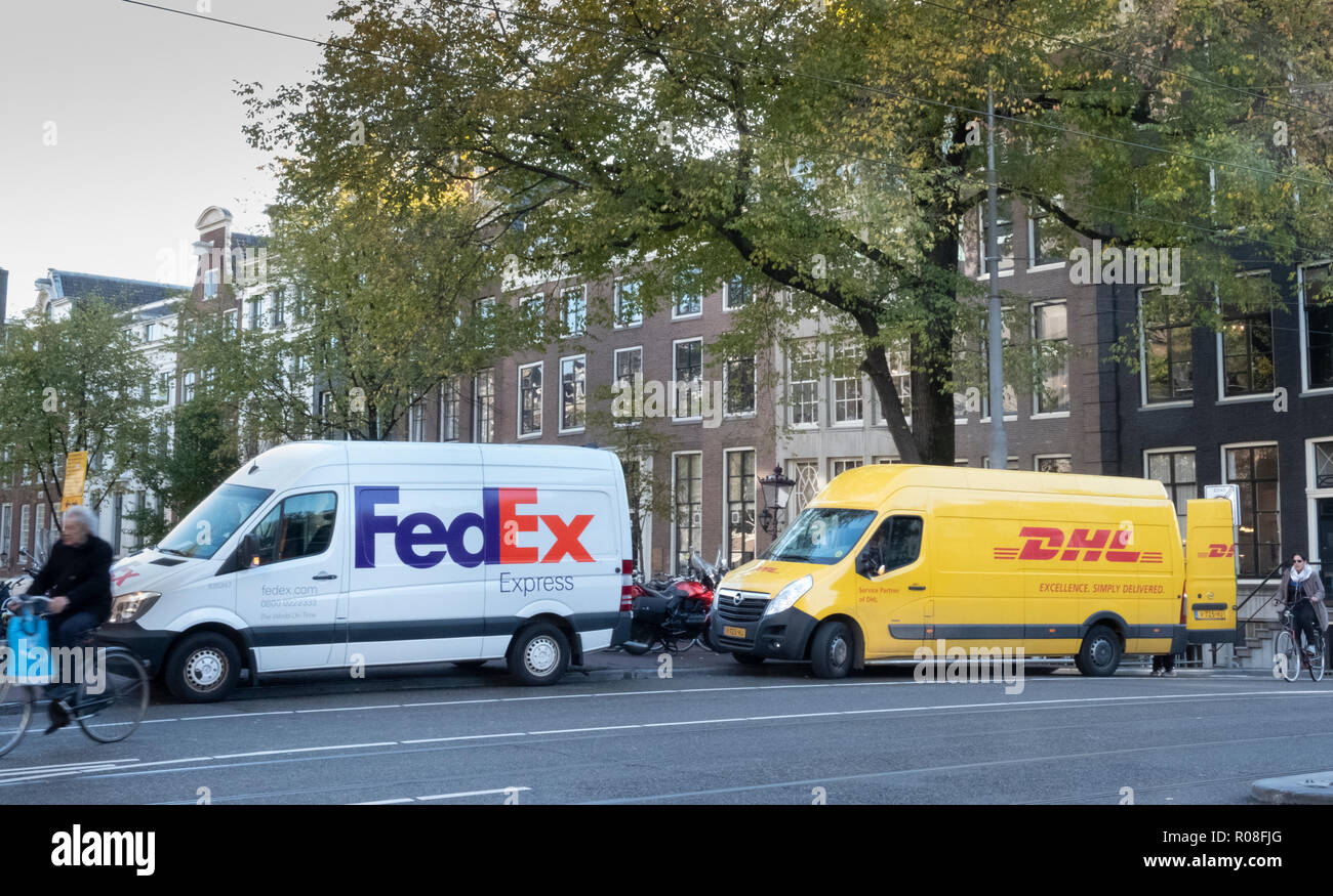 Competing parcel delivery in Amsterdam, Netherlands Stock Photo
