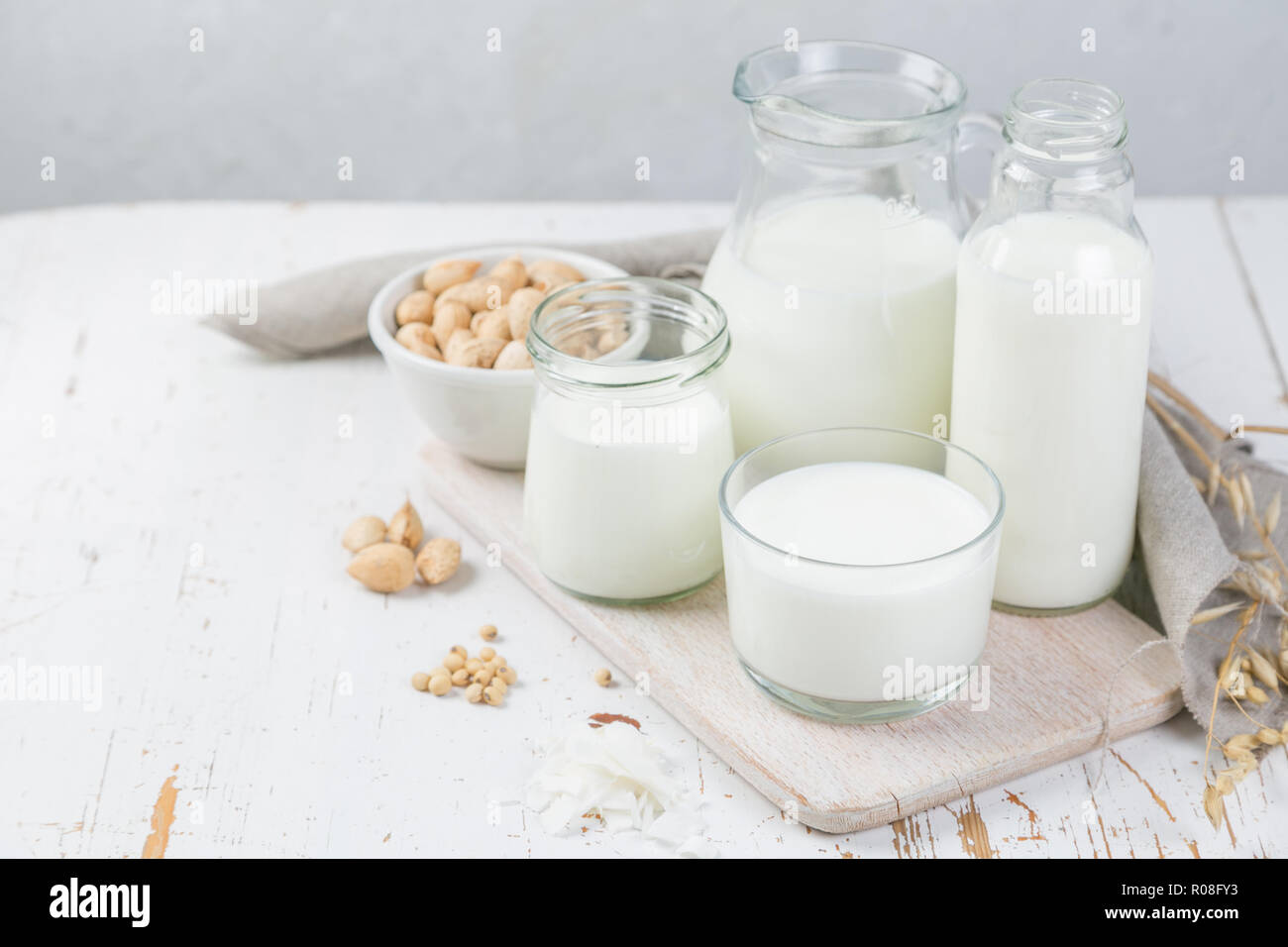Selection of non-dairy milk alternatives in different bottles. Lactose free milk. healthy lifestyle concept, copy space Stock Photo