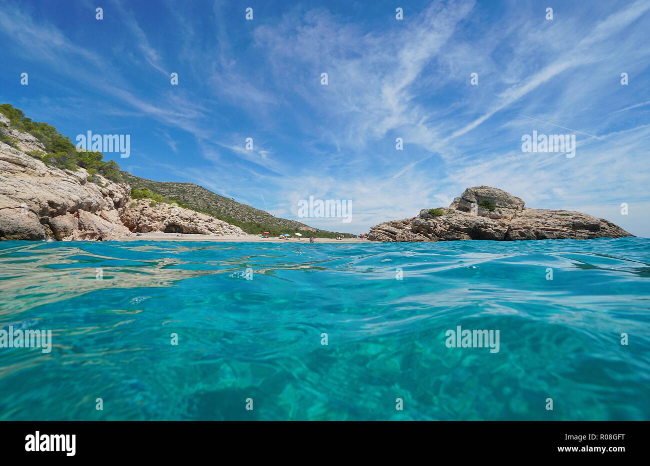 Spain Costa Dorada, the beach and the islet of Torn seen from the water surface, l’Hospitalet de l’Infant, Mediterranean sea, Tarragona, Catalonia Stock Photo