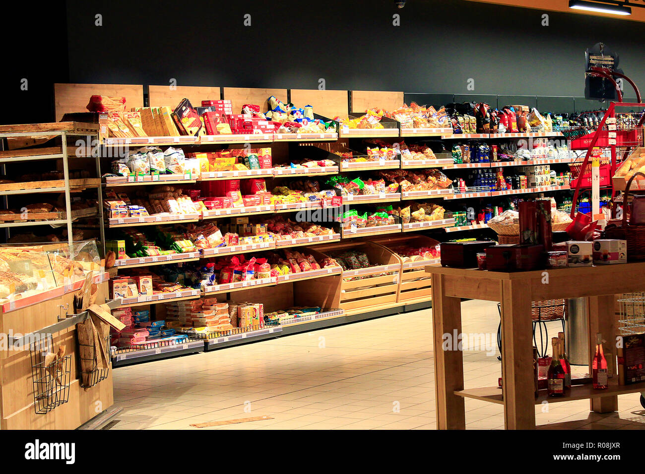 Grocery store with rich assortment of goods. Tea coffee bread. Wide choice of different product goods on shelves of supermarket Stock Photo