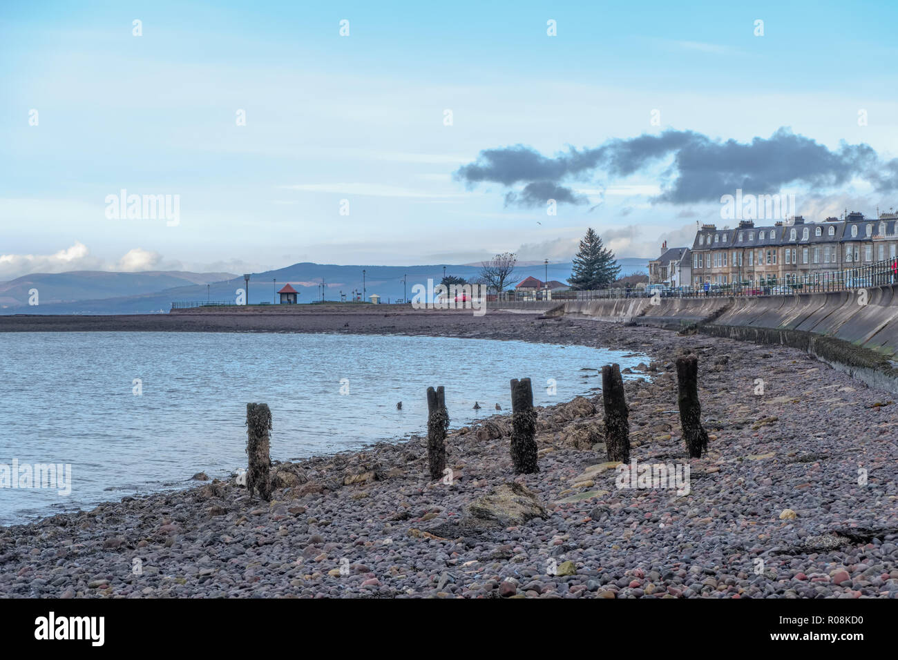 Looking over the old wooden pillars of  what was once the Hover craft jetty towards Aubery Point in largs Stock Photo