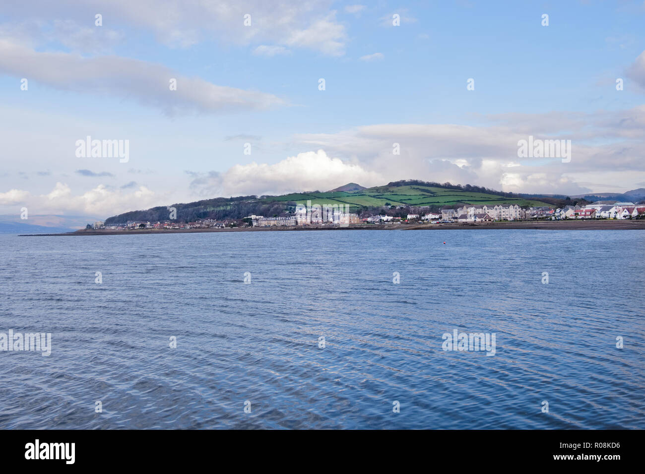 Looking into the North end of Largs across the water from the pierhead with Knockhill visable as well on a cold Octobers day in winter. Stock Photo
