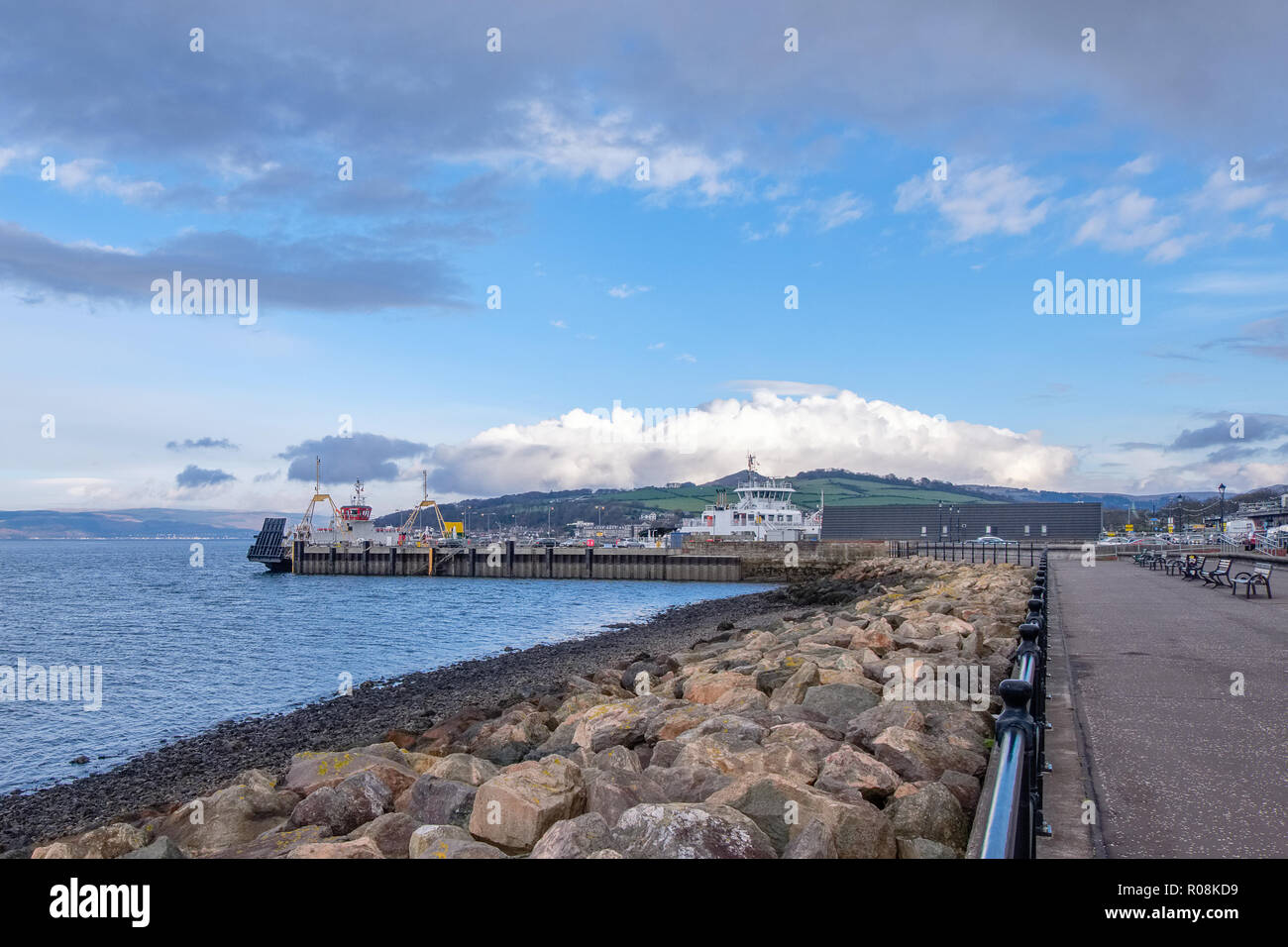 Looking along the sea defences to the pierhead in largs a coastal town in the est of Scotland Stock Photo