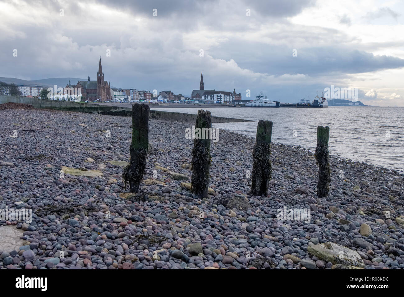 North Shore into the town of Largs via the old wooden pillars of the hover craft pier Stock Photo