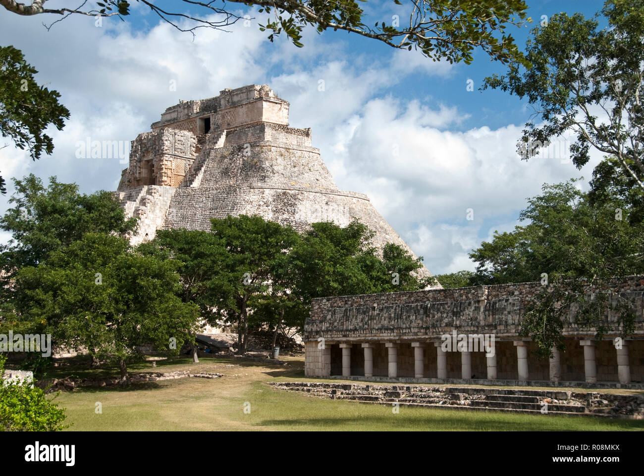 The Pyramid of the Magician (Piramide del Adivino) and a small, courtyard building in the Mayan city of Uxmal, Mexico. Stock Photo