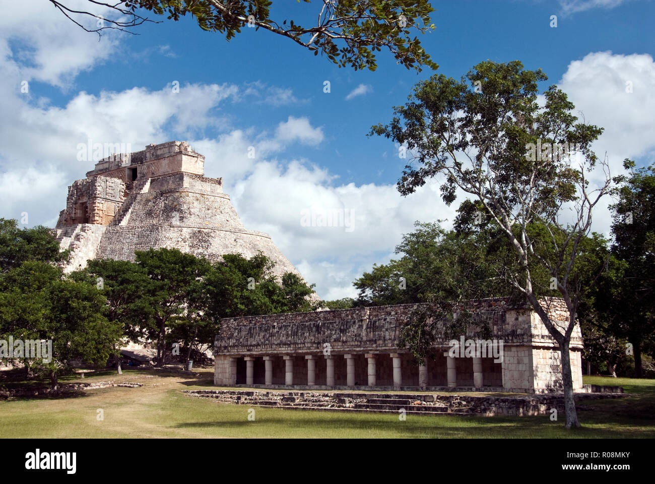 The Pyramid of the Magician (Piramide del Adivino) and a small, courtyard building in the Mayan city of Uxmal, Mexico. Stock Photo