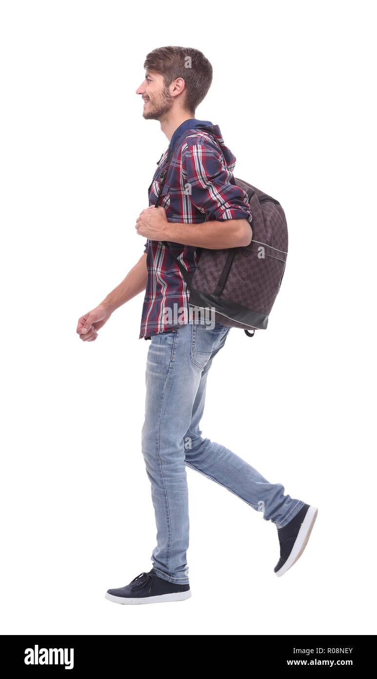 in full growth. a handsome male student steps forward.isolated on white ...