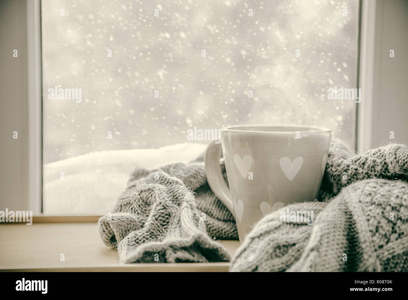 Winter cozy hot chocolate in front of window, snow, sweater. Lazy weekend,  love, comfort Stock Photo - Alamy