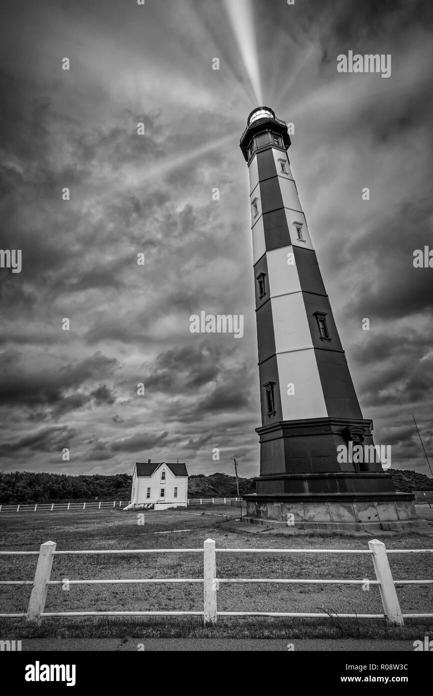 An old Virginia lighthouse watches over the Atlantic ocean on a stormy October day. Stock Photo