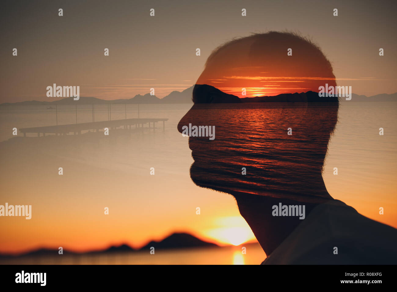 Man, sunset and sea. Psychotherapy concept. Multiple exposure. Stock Photo