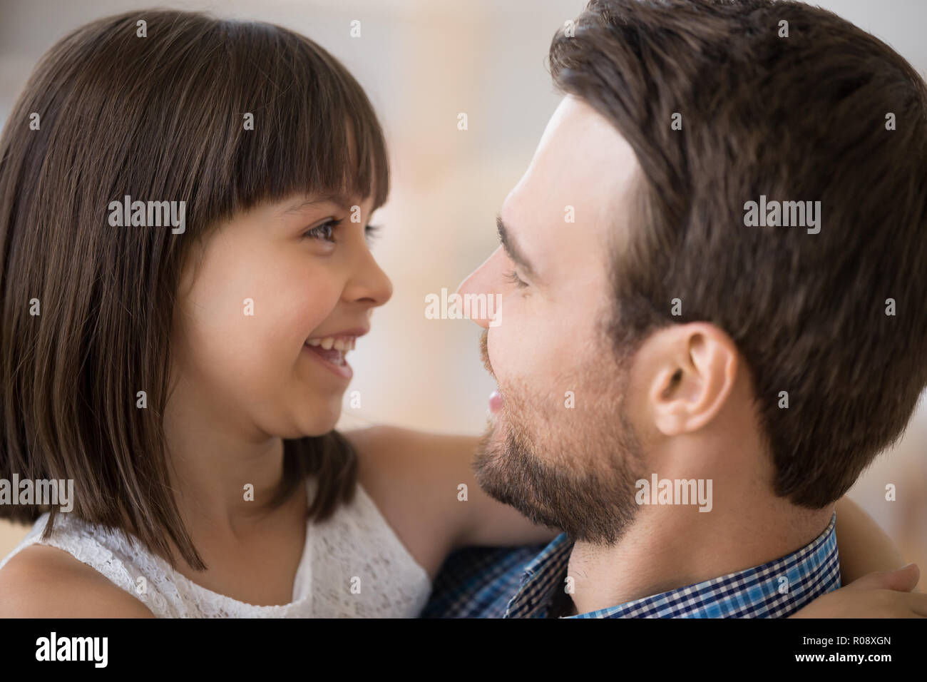 Close up faces of happy daughter and father Stock Photo