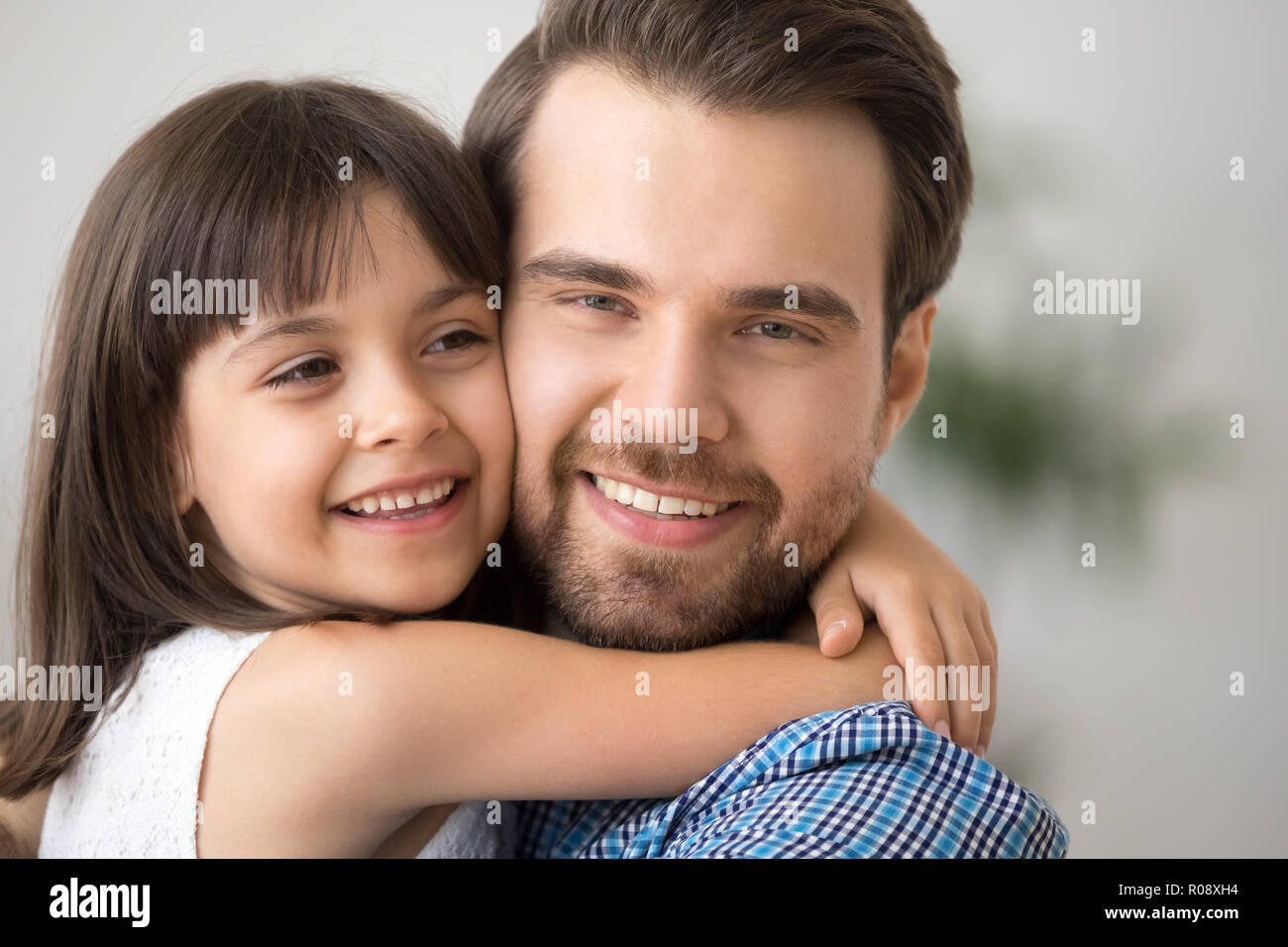 Close up portrait happy diverse family daughter and father Stock Photo