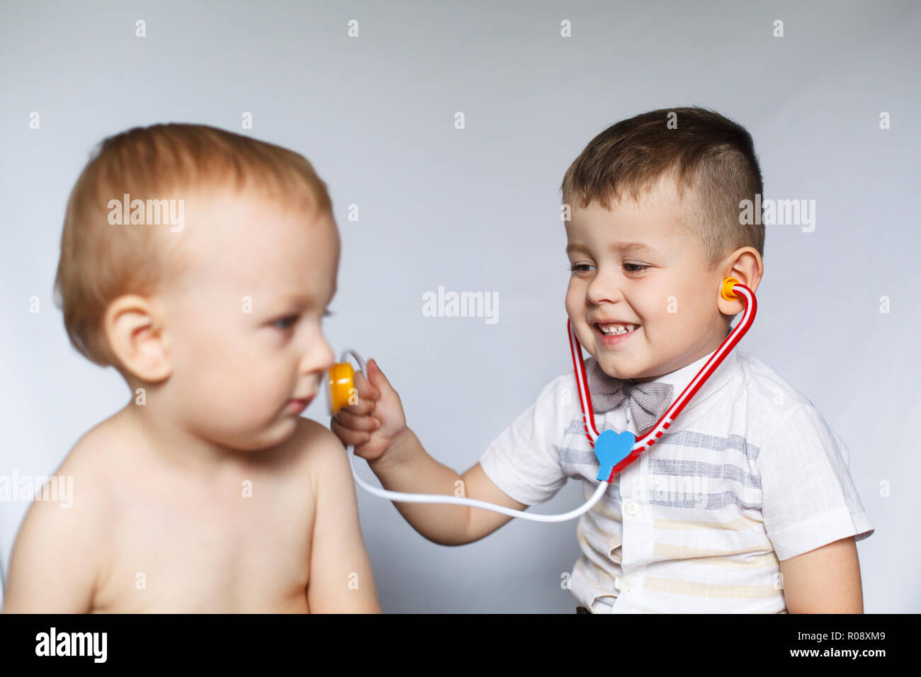 children playing doctor and patient two little boys using children play doctor