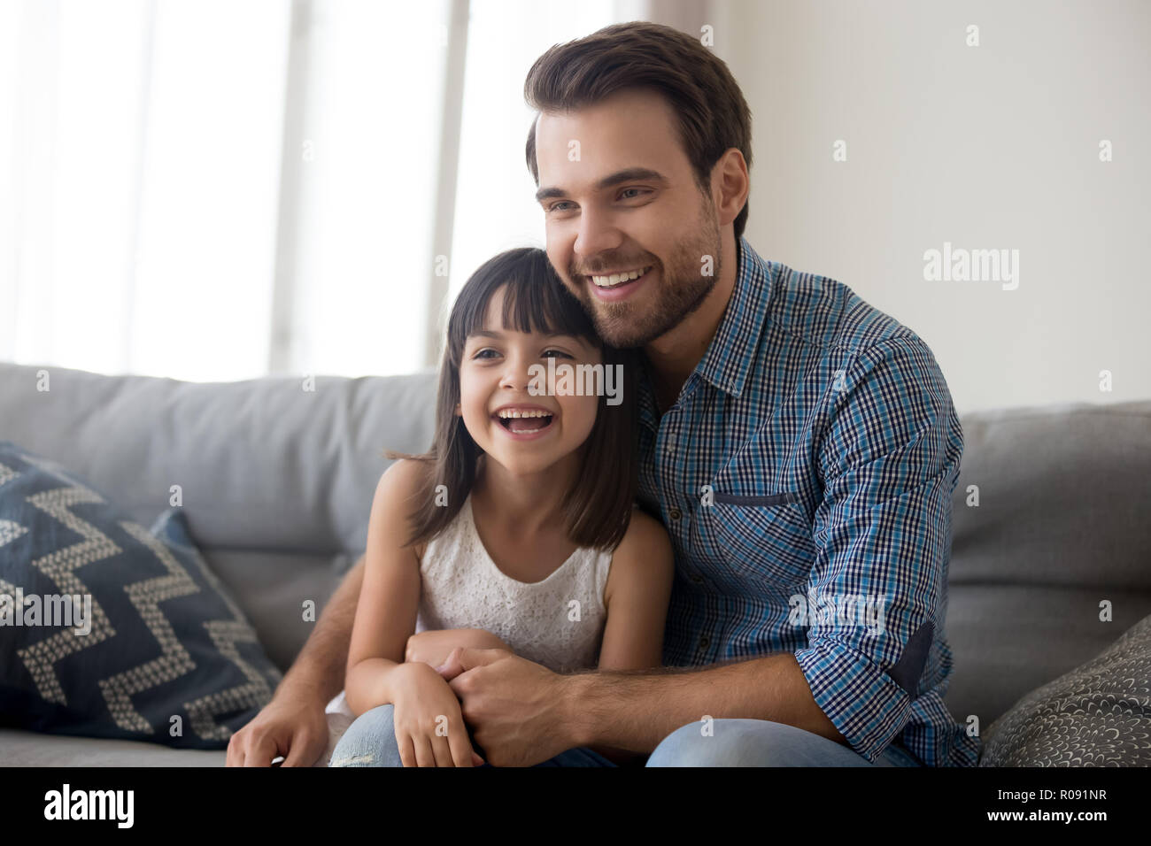 Father and daughter have video call or watching movie  Stock Photo