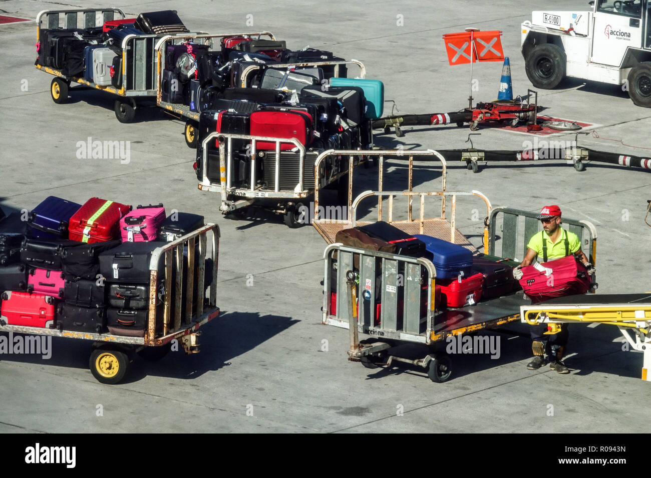 Palma de Mallorca Airport baggage handler, Spain suitcases airport Stock Photo
