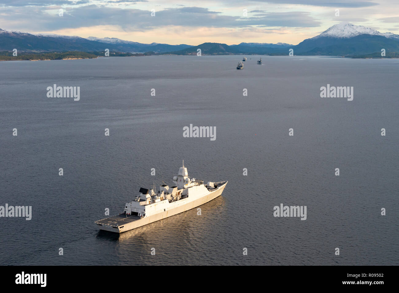 NORWAY, Nov. 1.  2018. GEN. SNMG2 VESSELS ESCORT AMPHIBIOUS TASK GROUP   HNLMS Johan de Witt , HNLMS Karel Doorman, and FS Dixmude in the Molde Fjords to conduct Amphibious Assault.  Trident Juncture 18 is designed to ensure that NATO forces are trained, able to operate together and ready to respond to any threat from any direction. Trident Juncture 18 takes place in Norway and the surrounding areas of the North Atlantic and the Baltic Sea, including Iceland and the airspace of Finland and Sweden.     With around 50,000 participants from 31 nations Trident Juncture 2018 is one of NATO’s larges Stock Photo